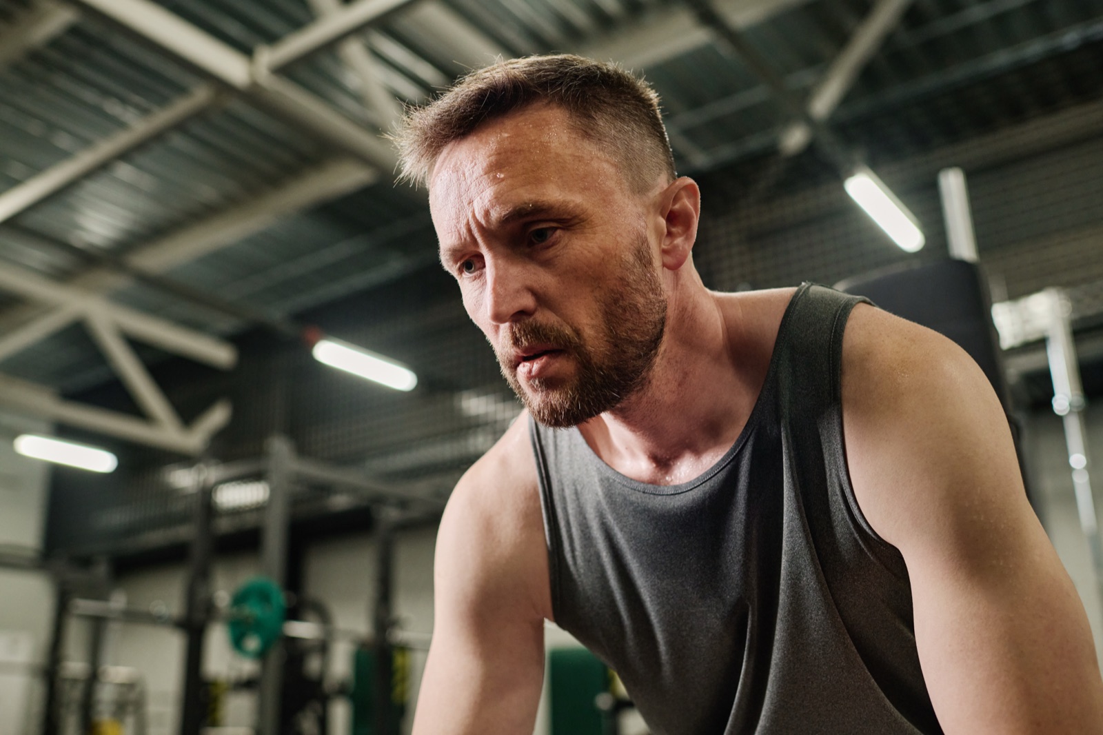 A man training with focus in a gym